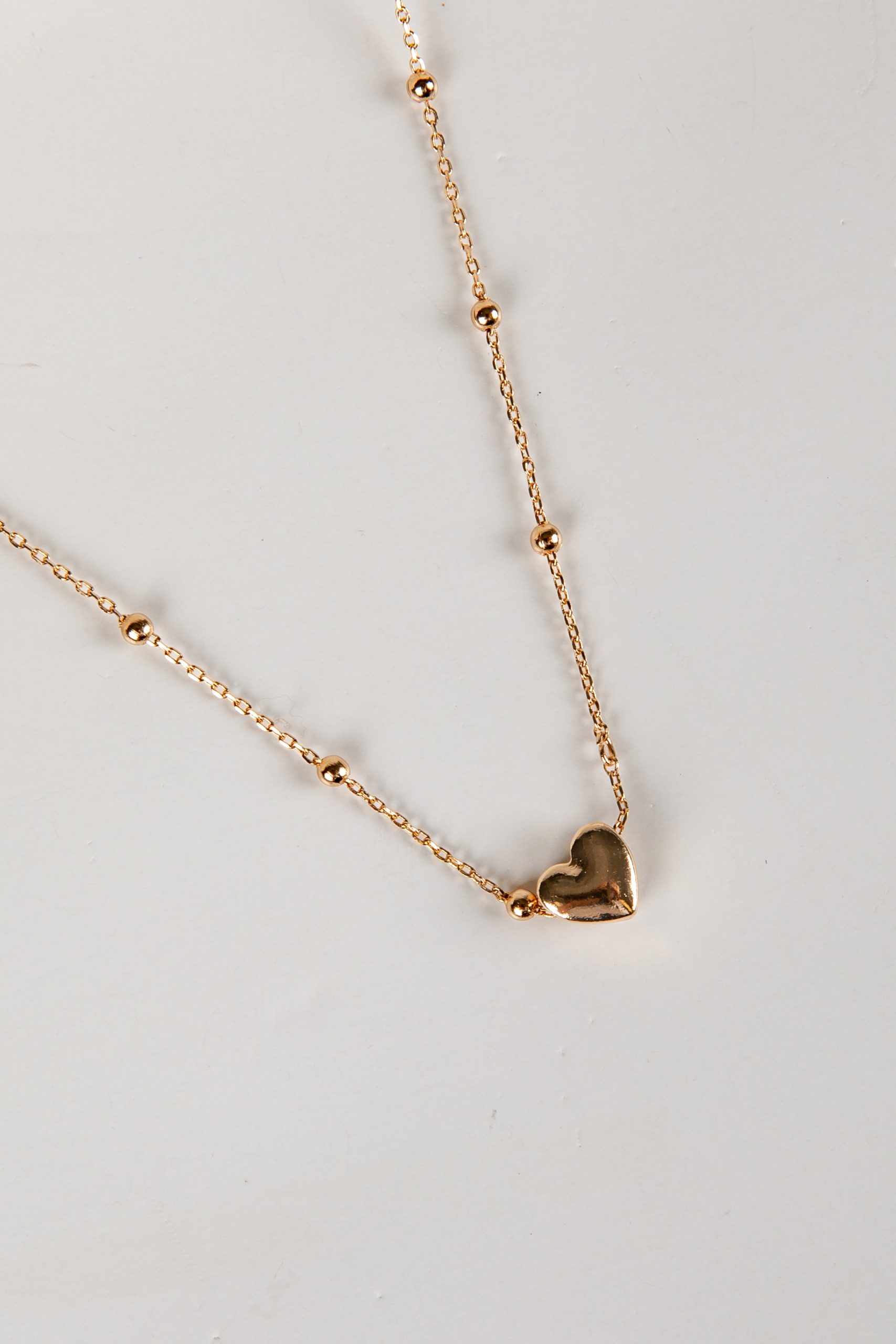 shopdressup_gold_heart_charm_necklace-2_71d7da74-2bb6-453f-97c6-85e6b7045804.jpg