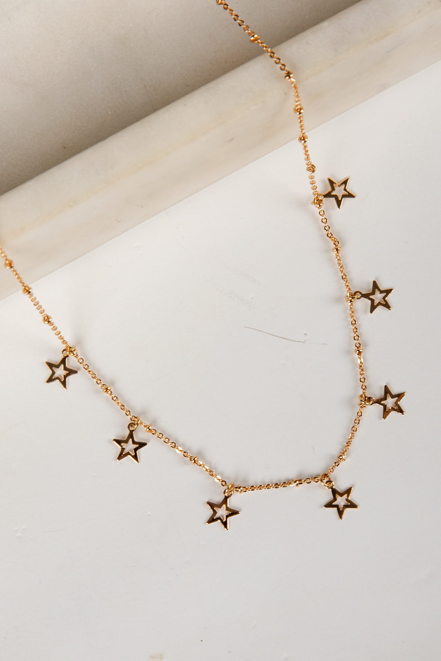 shopdressup_gold_star_charm_necklace-3.jpg